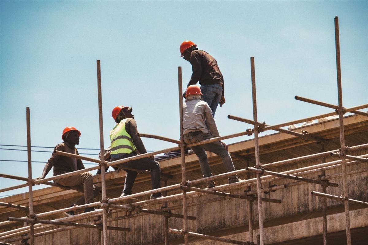 Construction crew working on scaffolding